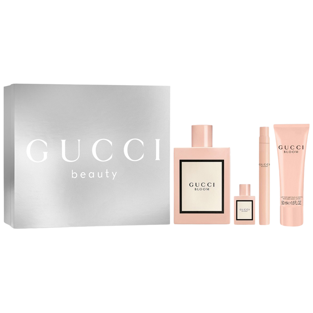 The elegant powder pink bottles of the Gucci Bloom Gift Set arranged beautifully