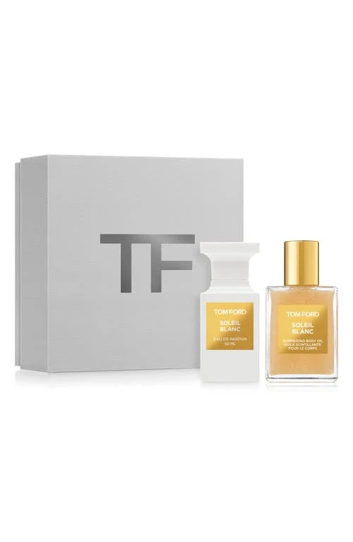 The golden Private Blend Soleil Blanc gift set showcasing the shimmering oil and elegant perfume bottle