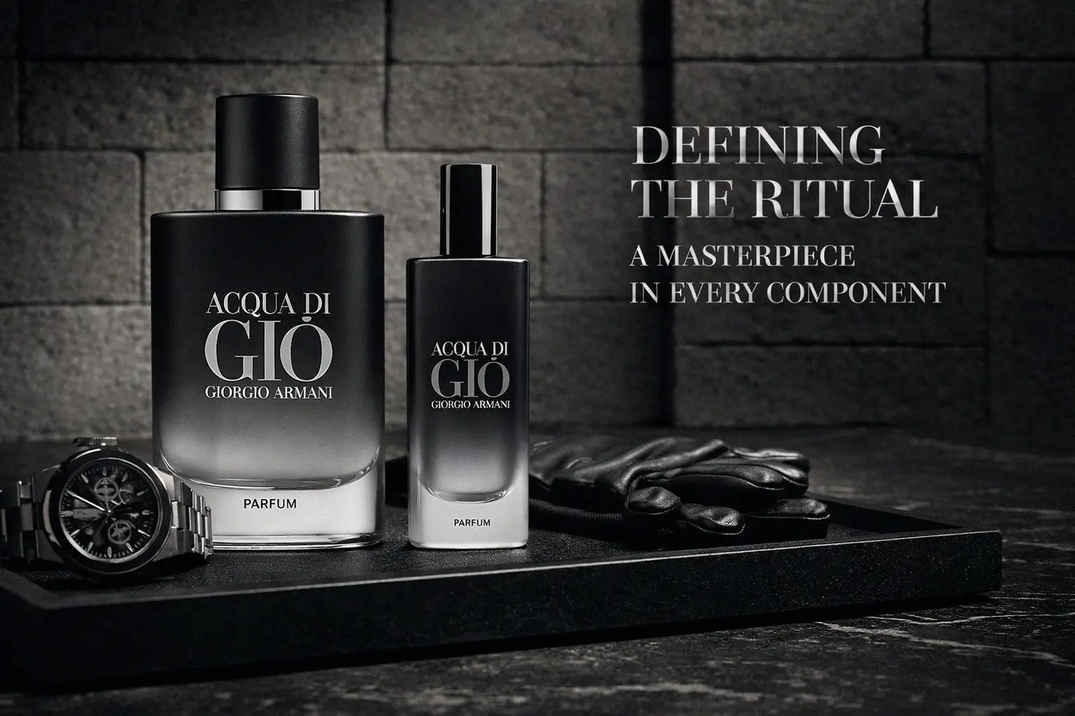 Giorgio Armani Acqua Di Gio Parfum gift set in a black box with a large bottle and a travel spray.