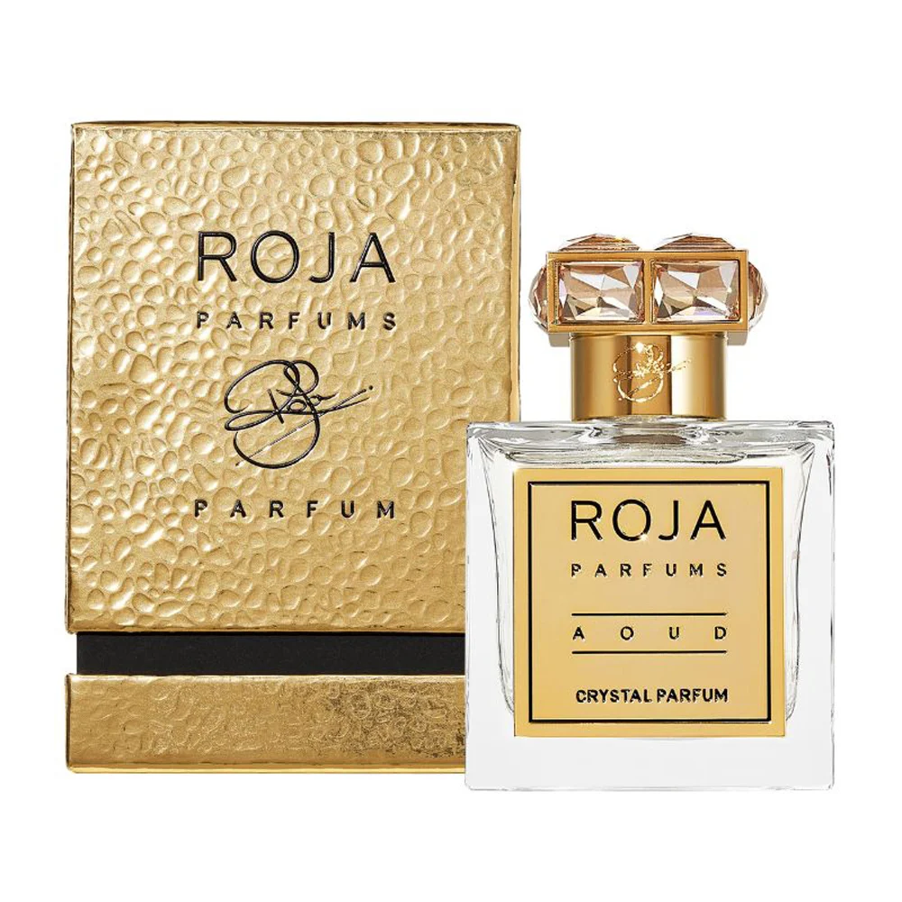 The crystal clear glass bottle of this luxury oud fragrance featuring gold accents