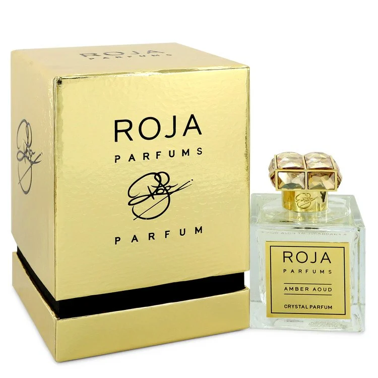 A sleek bottle of Amber Aoud Crystal by Roja Parfums reflecting soft light