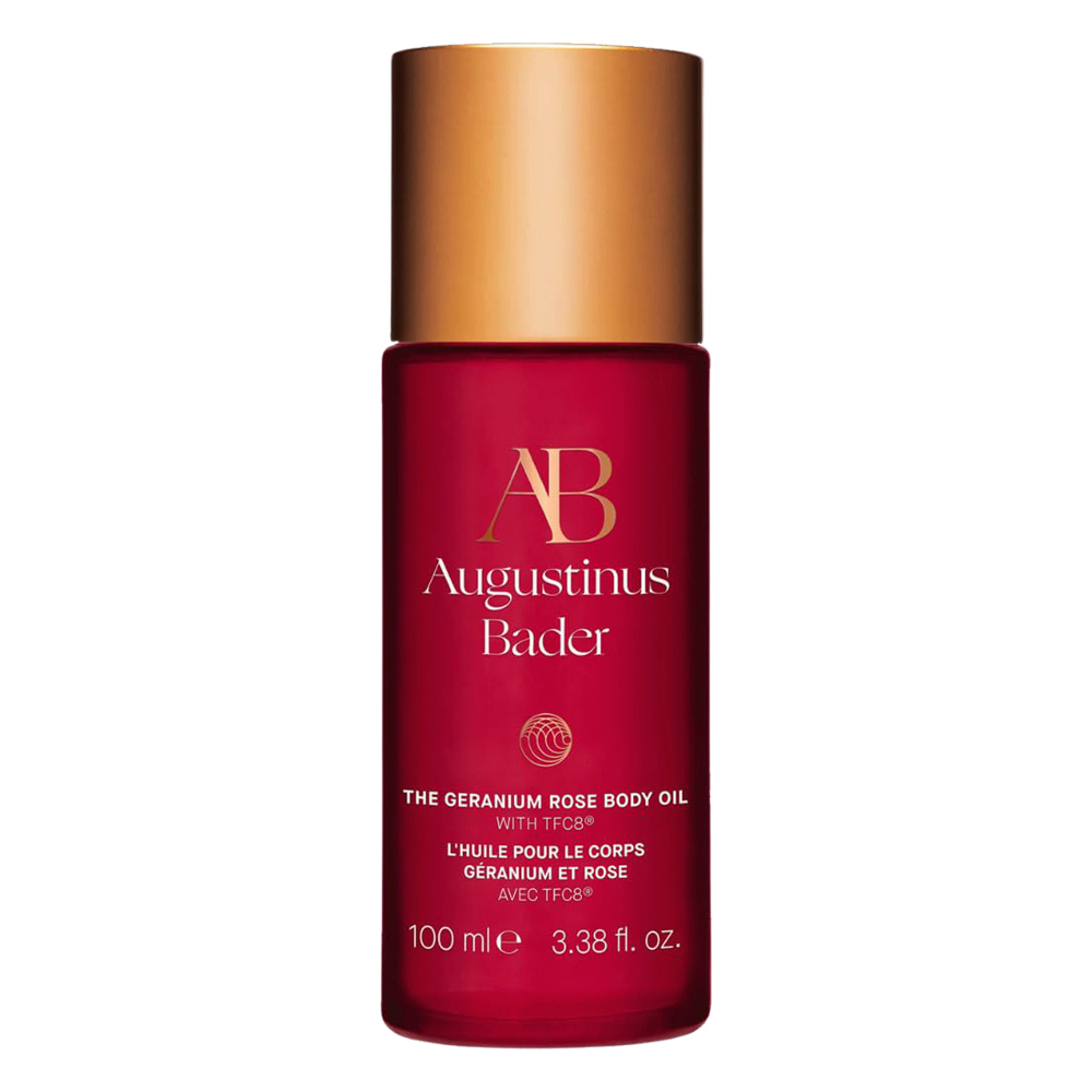Augustinus Bader Geranium Rose Body Oil on a polished surface