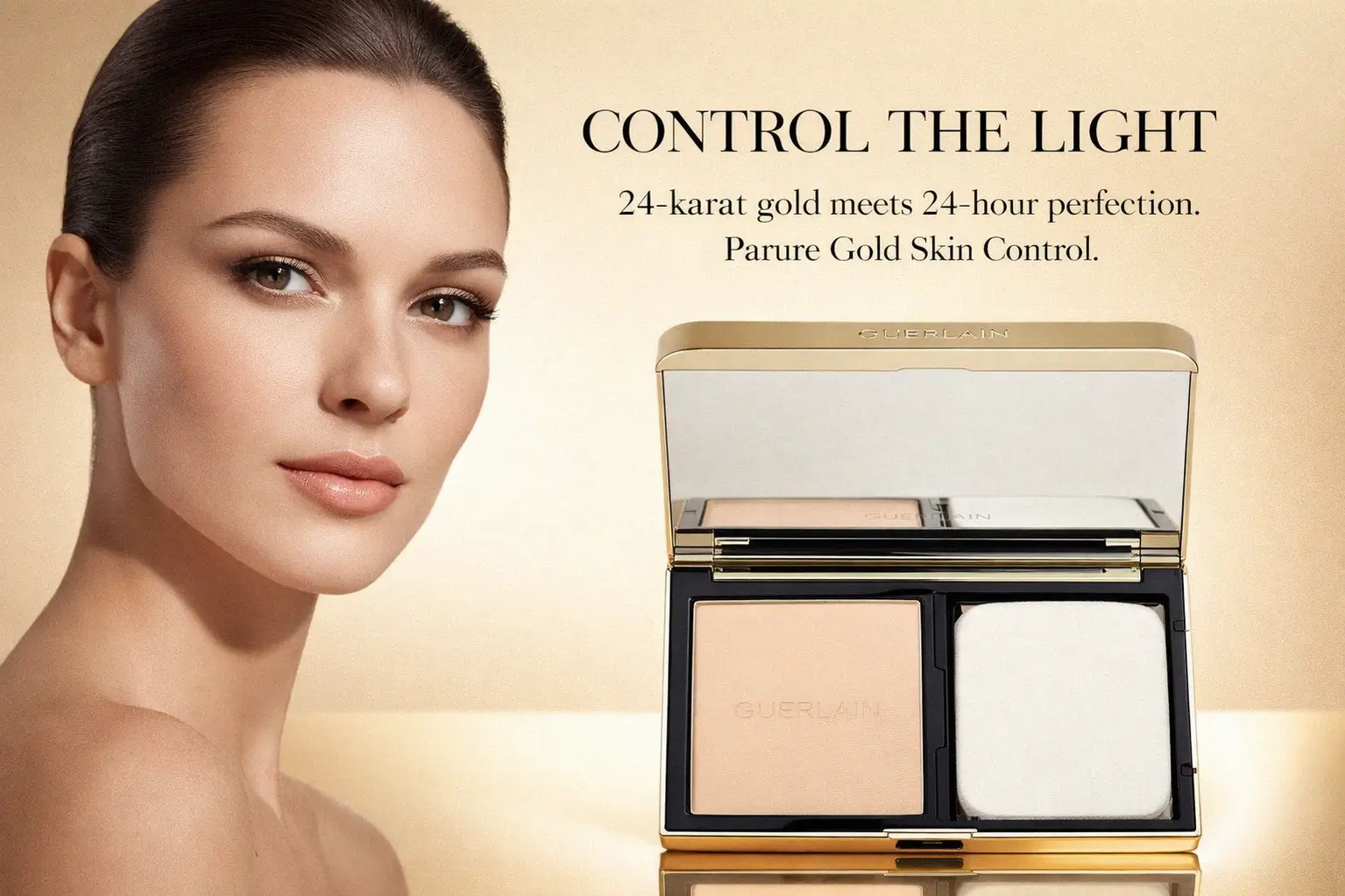 A luxurious gold-metallic refillable compact foundation with Guerlain branding and sponge applicator.