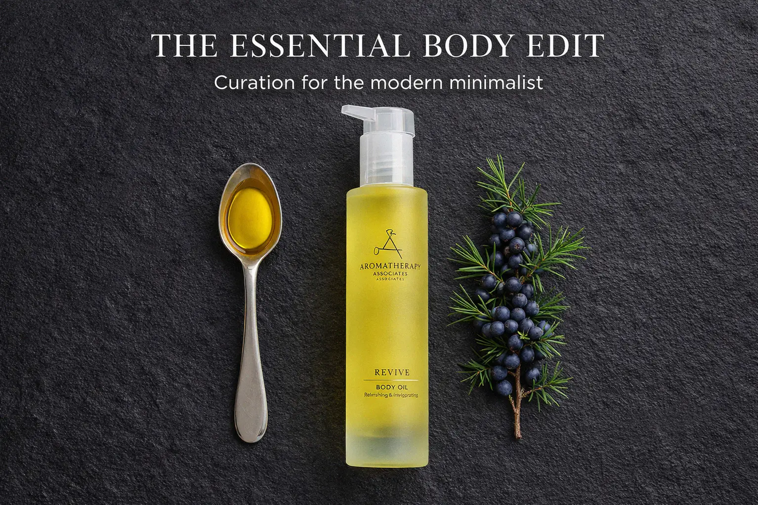 Sleek glass bottle of Aromatherapy Associates Revive Body Oil on a polished marble bathroom counter.