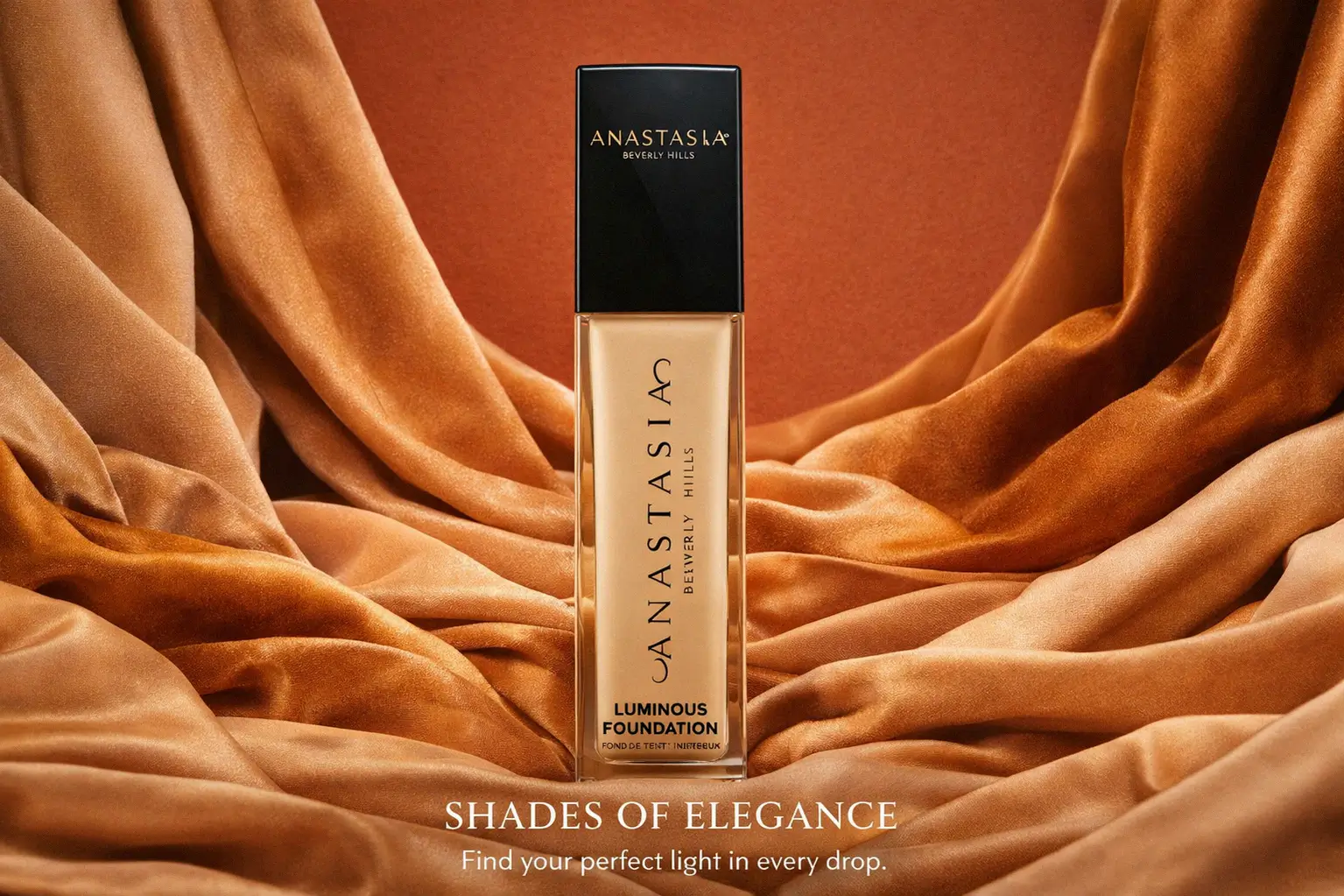 A bottle of Anastasia Beverly Hills Luminous Foundation with a black pump cap on a polished surface.