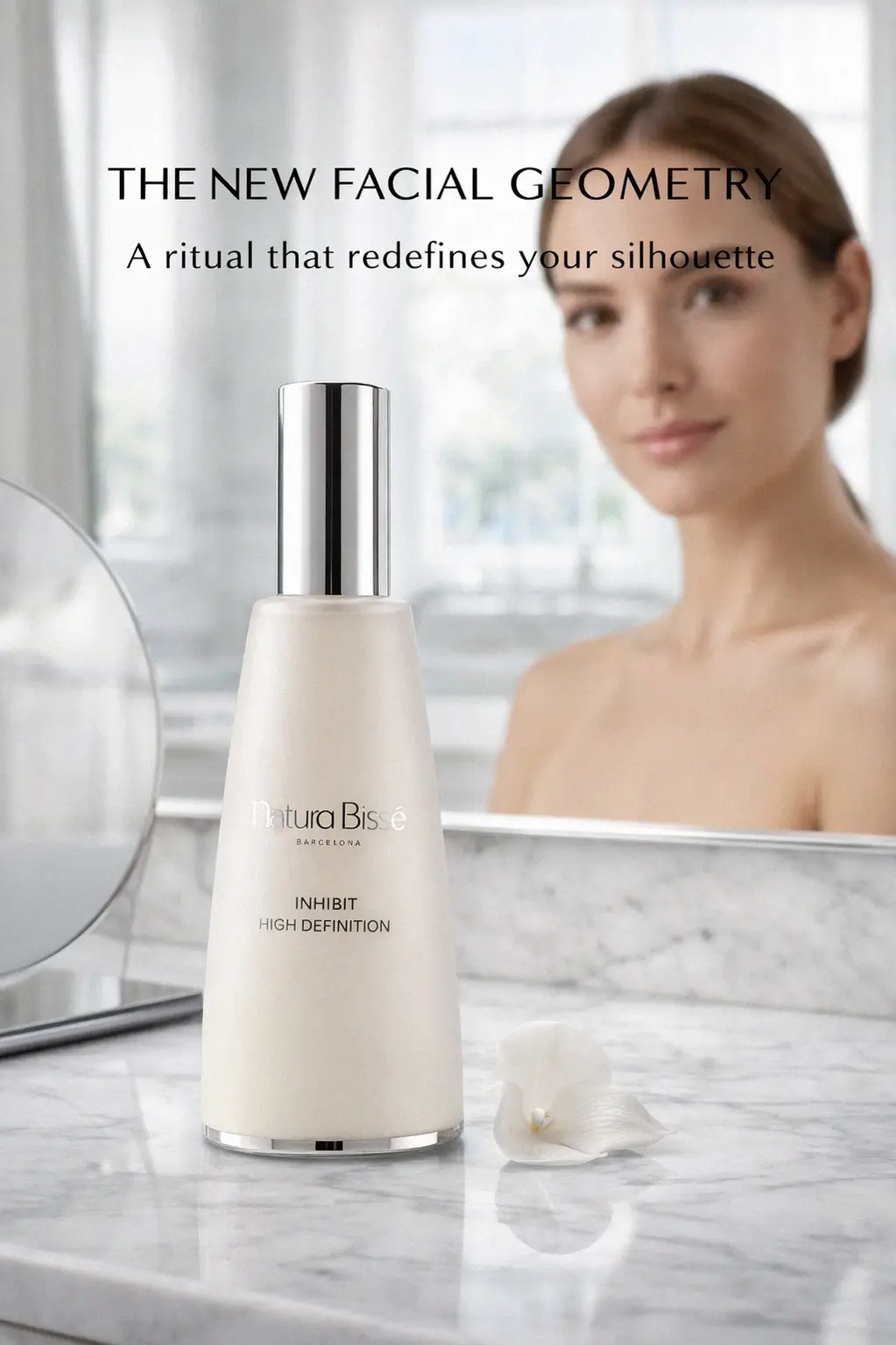 The sleek bottle of Natura Bisse serum on a marble vanity