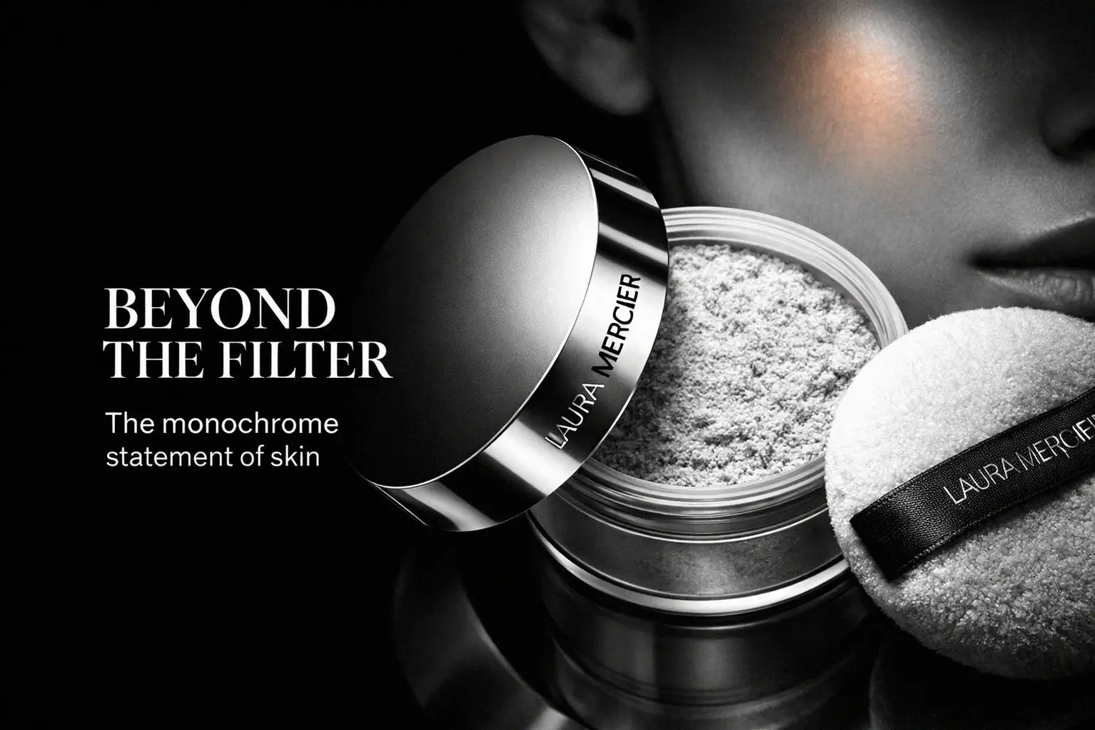Laura Mercier Ultra-Blur setting powder jar with a soft puff on a polished white vanity.