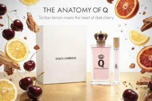 Dolce & Gabbana Q Eau de Parfum bottles with gold crown caps on a minimalist vanity.