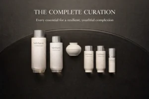 Sulwhasoo The Ultimate S Enriched Water and Emulsion bottles in elegant amber-toned packaging on a white surface.