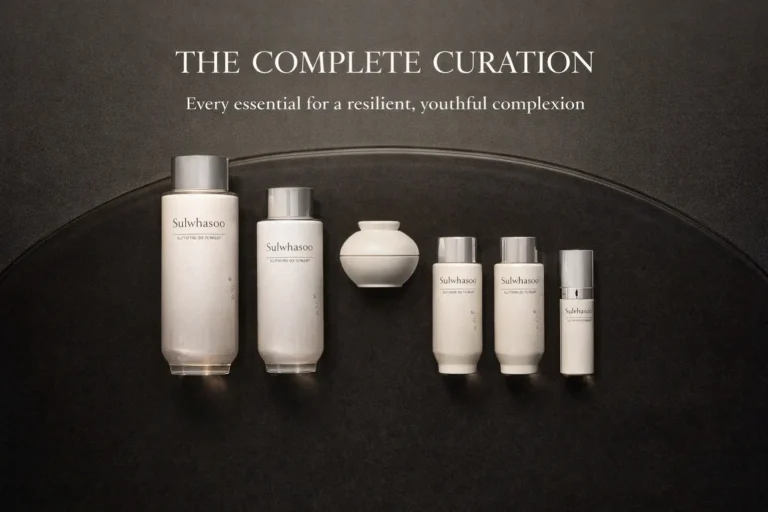 Sulwhasoo The Ultimate S Enriched Water and Emulsion bottles in elegant amber-toned packaging on a white surface.