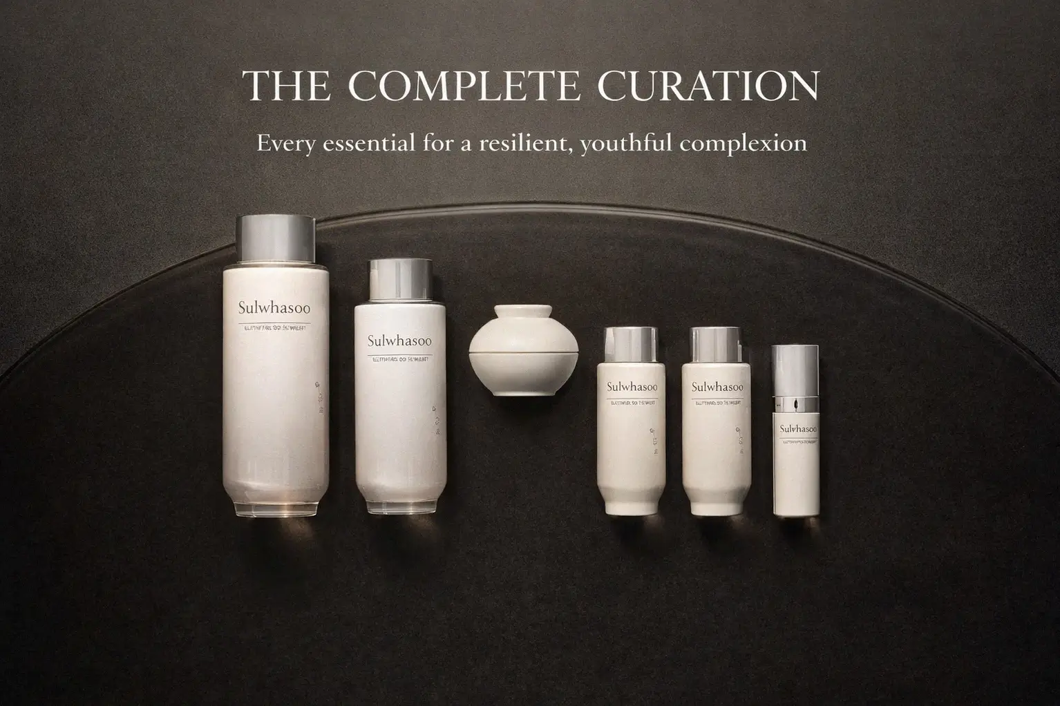 Sulwhasoo The Ultimate S Enriched Water and Emulsion bottles in elegant amber-toned packaging on a white surface.