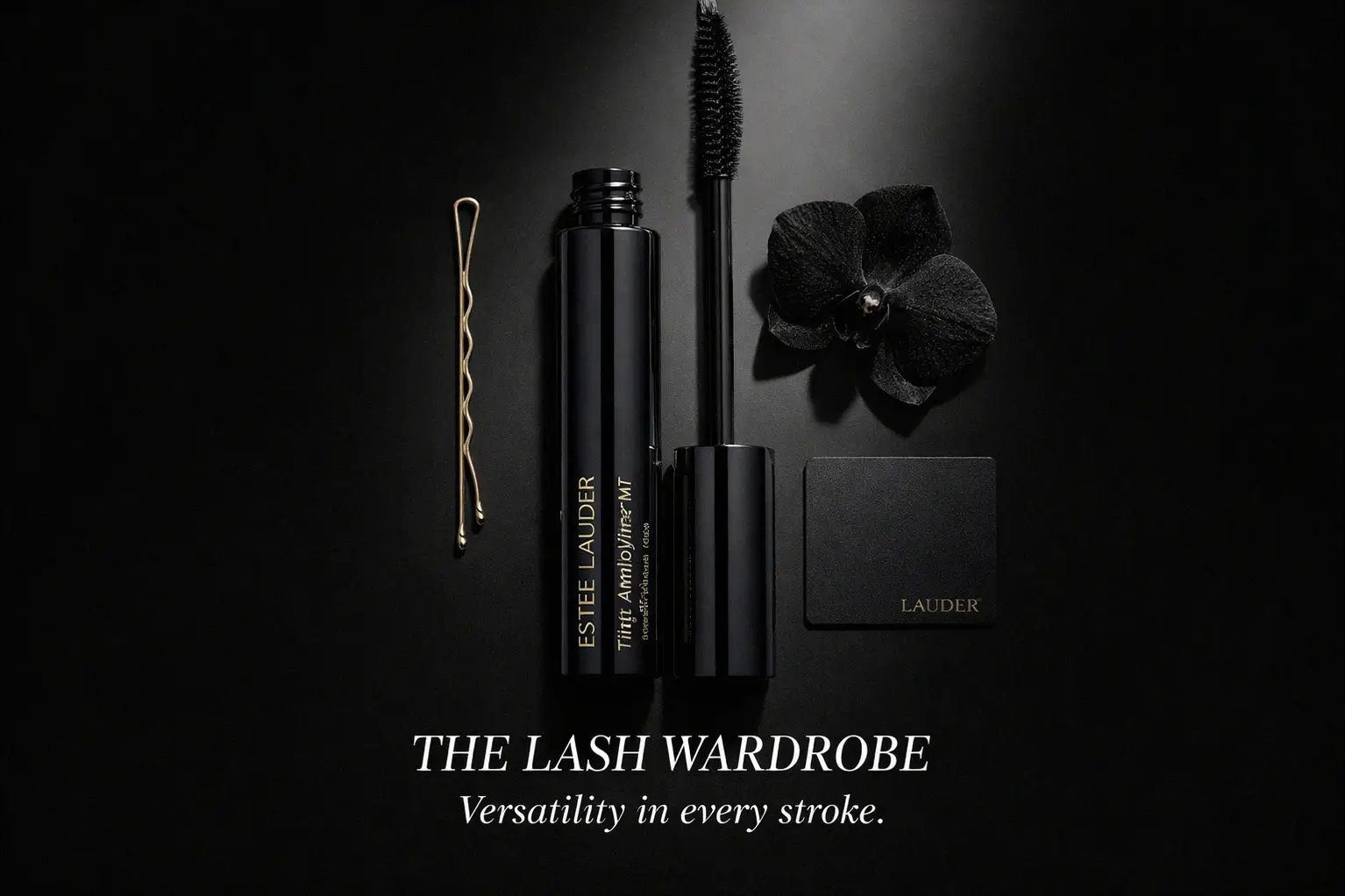 Estée Lauder Little Black Primer tube with a precise thin brush on a clean beauty vanity.