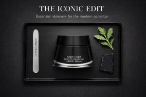 Elegant black glass jar of Giorgio Armani Crema Nera Supreme Light Reviving Cream on a vanity.