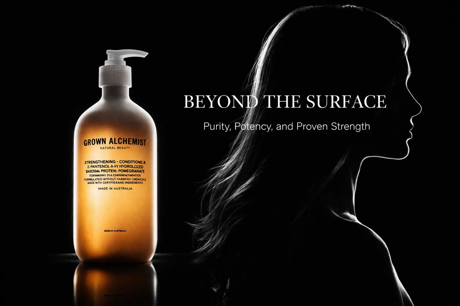 A minimalist 16.9 oz bottle of Grown Alchemist Strengthening Conditioner 0.2 on a white bathroom counter.