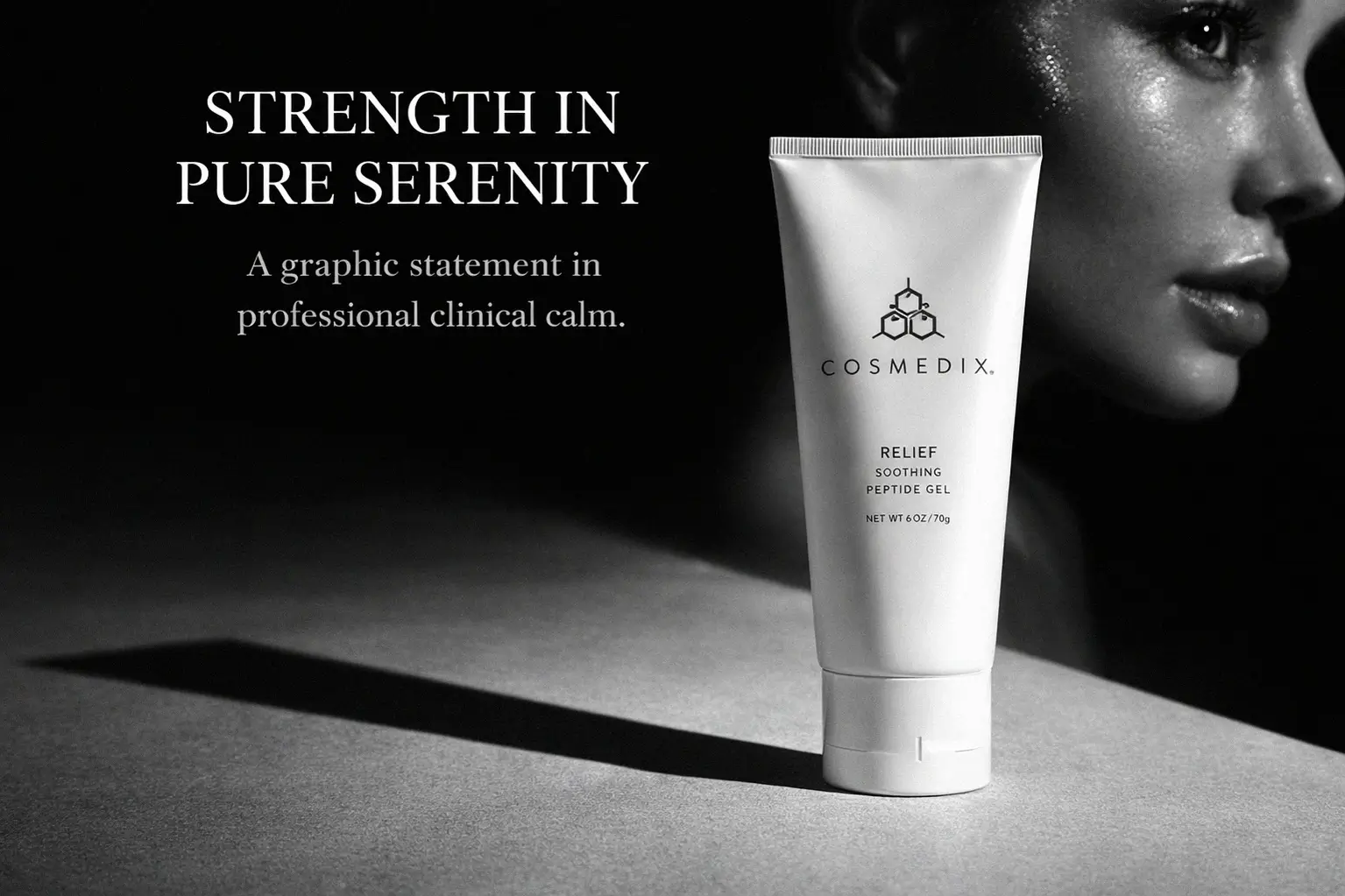 Clear bottle of COSMEDIX Elite Relief Soothing Peptide Gel on a white marble vanity shelf.