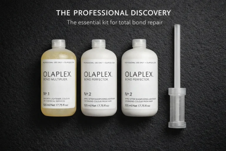 Three large professional Olaplex bottles with a dosing dispenser on a clean white salon-style background.