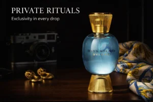 An azure blue and gold glass perfume bottle of Bvlgari Allegra Riva Solare against a bright background.