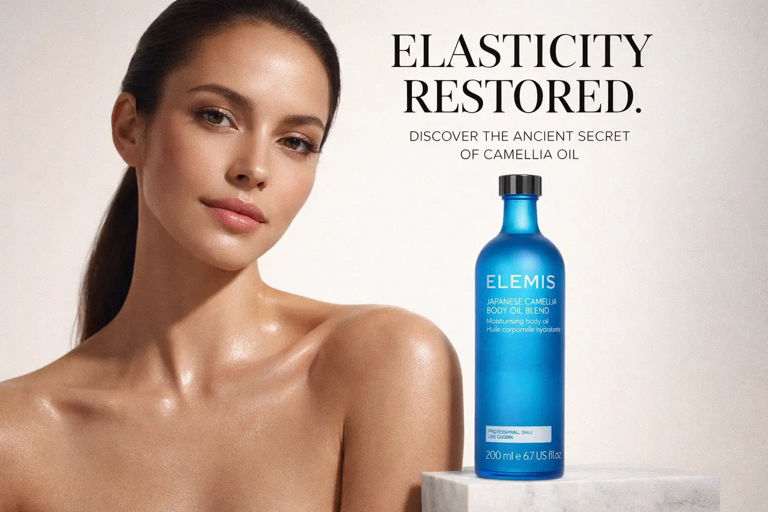 Glass bottle of Elemis Japanese Camellia Body Oil Blend on a polished bathroom shelf.