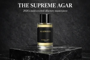 A sleek 100ml HEELEY Agarwoud Extrait de Parfum bottle with a minimalist label on a marble surface.