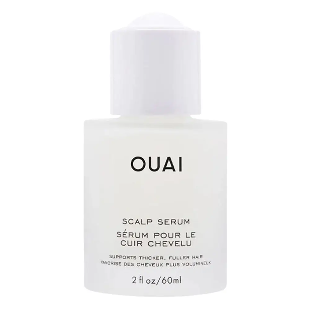 The Ouai Scalp Serum bottle on a marble vanity