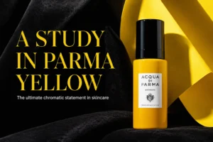 Sleek glass bottle of Acqua Di Parma Barbiere Multi-Action Face Cream on a stone surface.