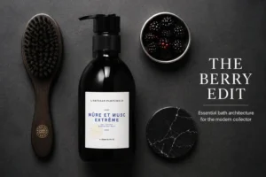 A 300ml pump bottle of L'Artisan Parfumeur Mure et Musc Extreme Hand and Body Wash on a marble shelf.