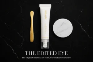 Alpha-H Liquid Gold Firming Eye Cream tube with a cooling ceramic applicator tip on a clean surface.