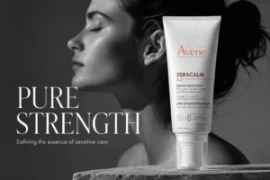 Large white bottle of Avene XeraCalm A.D balm with a sterile pump dispenser on a clean white surface.