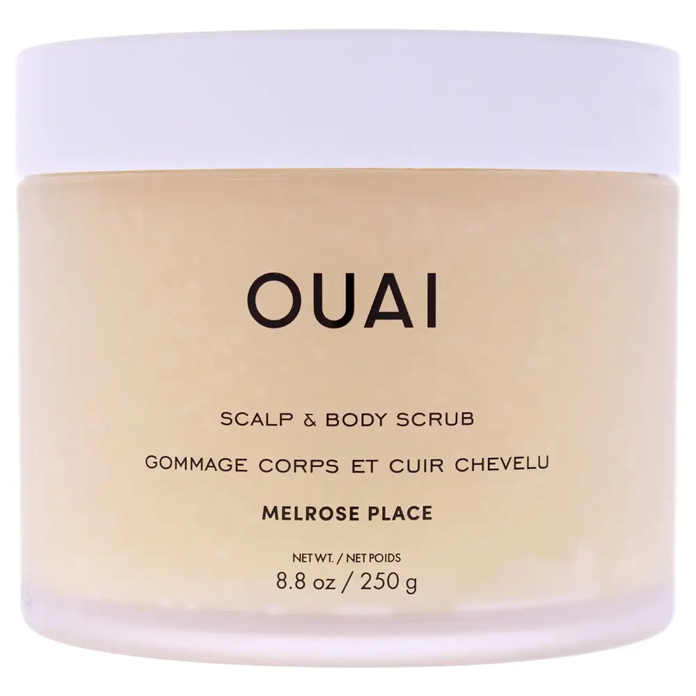 The Ouai Scalp & Body Scrub displayed on a minimalist marble vanity