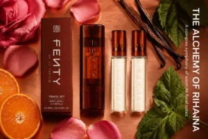 Three 10ml amber glass perfume vials and a sleek brown twist-and-spray travel case on a neutral background.