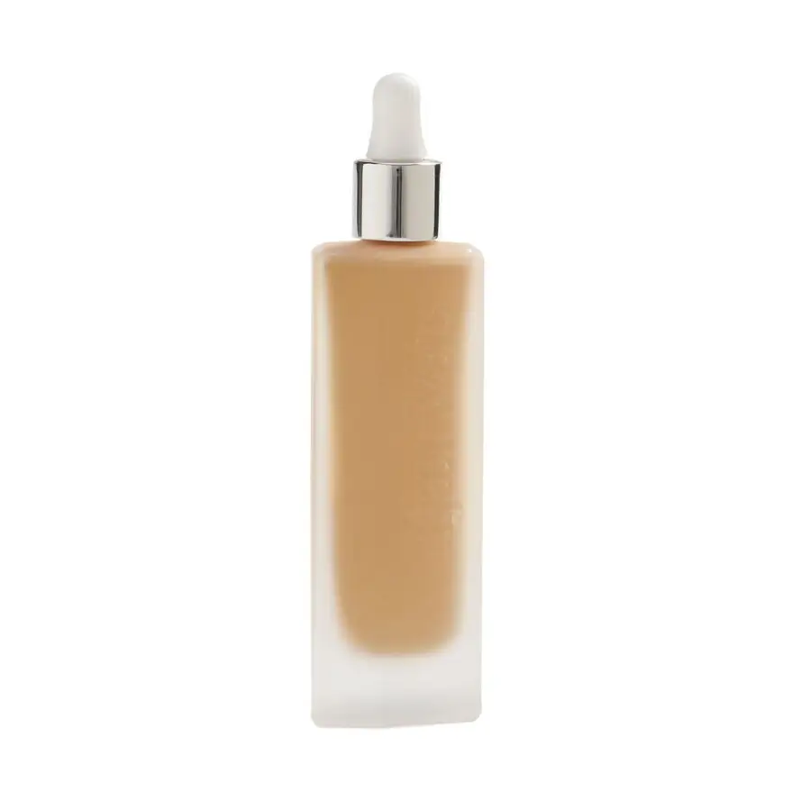 Kjaer Weis Invisible Touch Liquid Foundation in a glass bottle