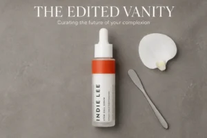 Indie Lee Stem Cell Serum glass bottle with a glass dropper on a clean white surface with soft lighting.