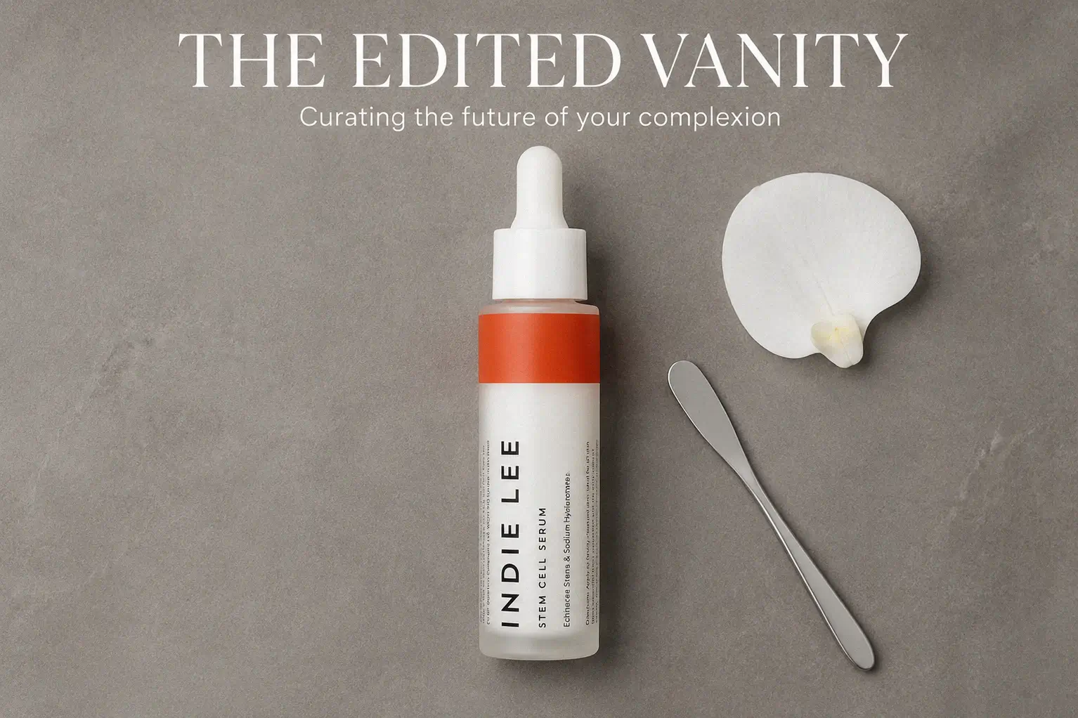 Indie Lee Stem Cell Serum glass bottle with a glass dropper on a clean white surface with soft lighting.