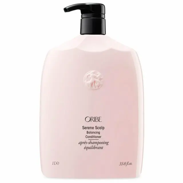 Oribe Serene Scalp Balancing Conditioner bottle on a minimalist vanity