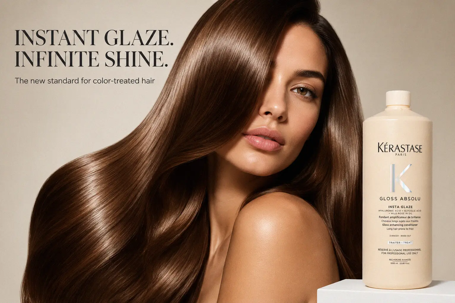 A sleek bottle of Kerastase Gloss Absolu Insta Glaze Conditioner on a polished bathroom shelf.