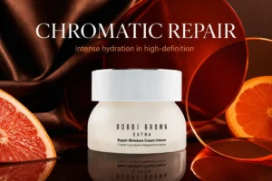 A refillable glass jar of Bobbi Brown Extra Repair Moisture Cream Intense on a clean, white marble vanity.
