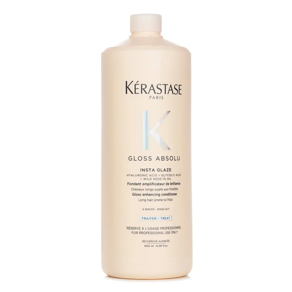 The Kerastase Gloss Absolu Insta Glaze bottle on a marble vanity