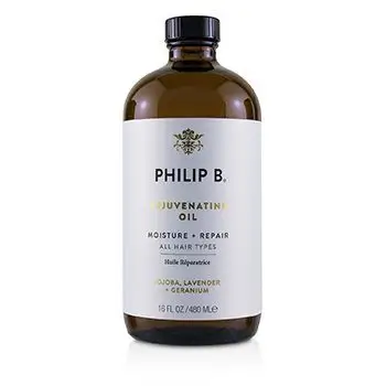 Philip B Rejuvenating Oil treatment bottle on a luxury vanity
