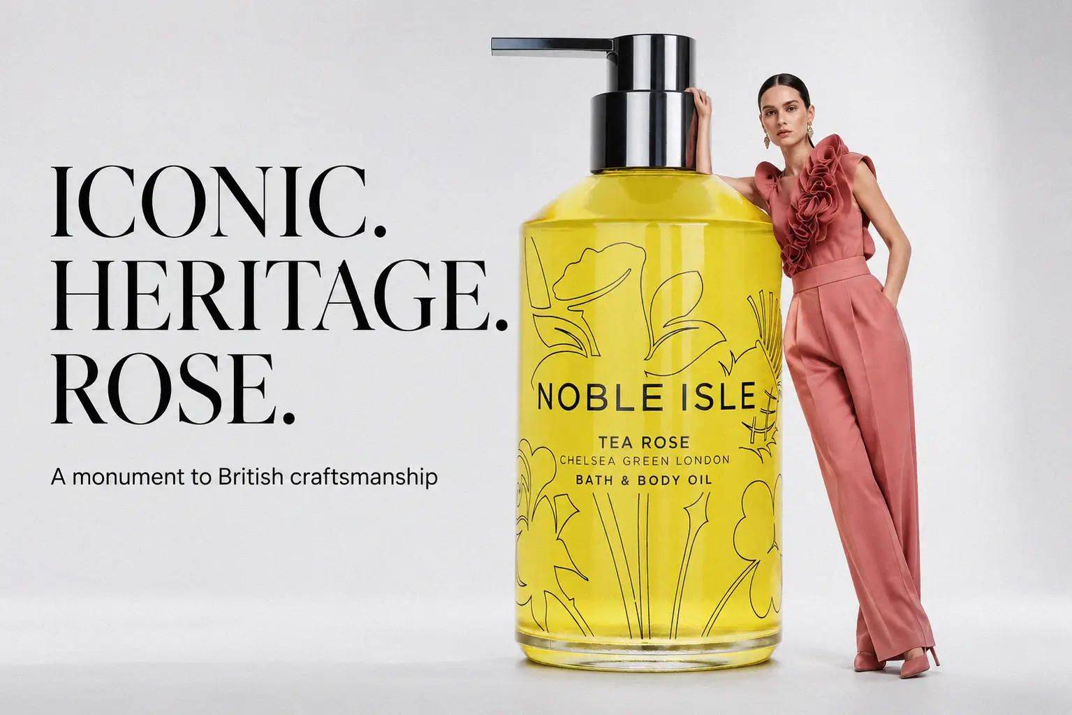 Noble Isle Tea Rose Bath & Body Oil bottle standing on a marble surface with soft lighting.