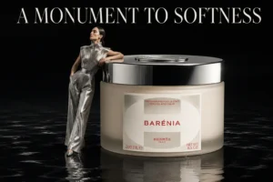 A 200ml jar of Hermès Barénia Perfumed Body Cream in elegant white and gold luxury packaging.
