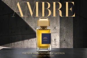A 3.4oz glass spray bottle of BDK Parfums Ambre Safrano with a gold cap on a clean surface.