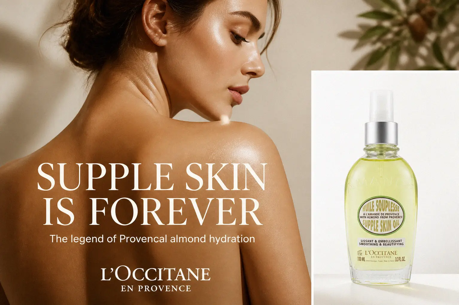 A spray bottle of L'Occitane Almond Supple Skin Oil on a marble surface with almond accents.