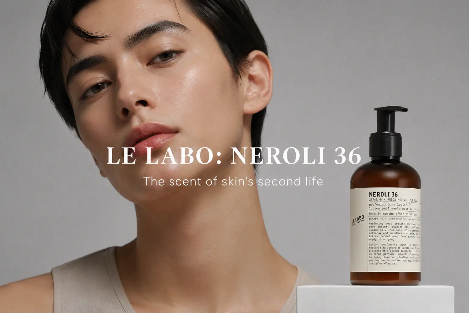 Sleek Le Labo Neroli 36 Body Lotion bottle on a marble bathroom vanity next to a white towel.