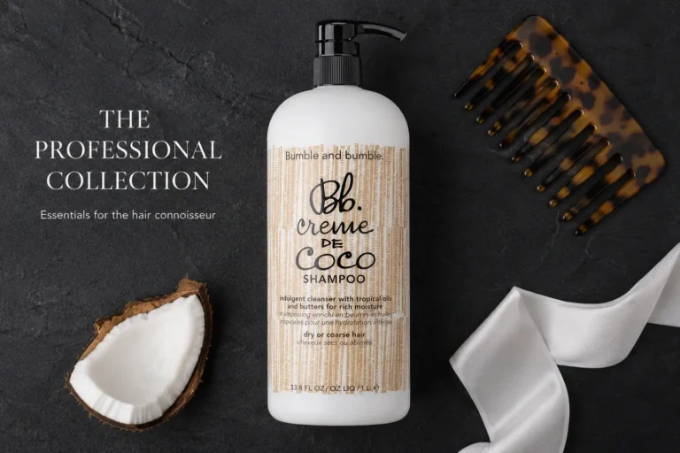 A large 33.8 oz bottle of Bumble and bumble Creme de Coco Shampoo on a clean white vanity shelf.