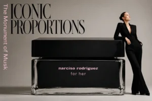 Minimalist 5.2 oz jar of Narciso Rodriguez For Her Body Cream on a polished white surface.