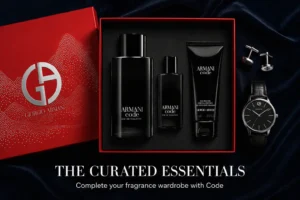Armani Code fragrance set featuring a black cologne bottle, travel spray, and body shampoo tube.