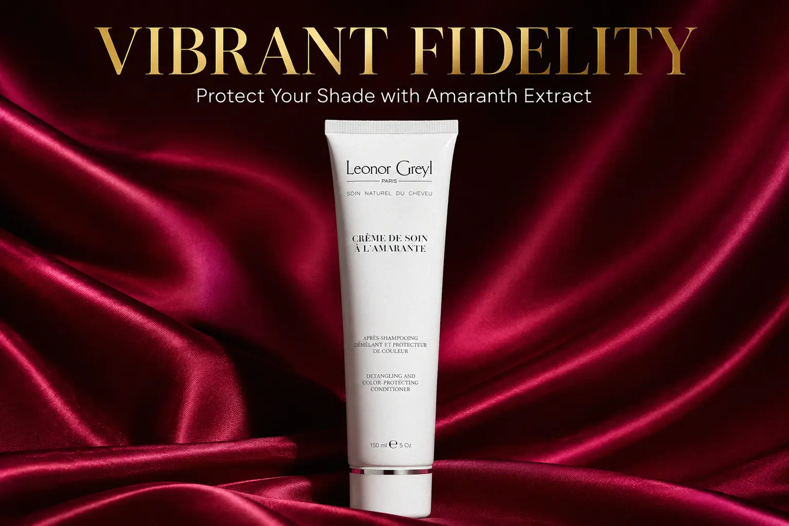 A sleek airless tube of Leonor Greyl Paris Crème de Soin à l'Amarante on a white marble surface.