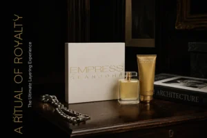 A white and gold Sean John Empress perfume bottle and a large tube of body cream in an elegant gift box.