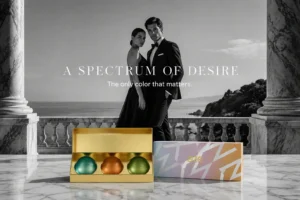 Three glass perfume bottles labeled Awe, Nomad, and Id arranged inside a premium Eze gift box.
