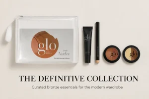 Glo Skin Beauty In the Nudes Gift Set in Backlit Bronze with Shadow Stick and Lip Balm on a white surface.